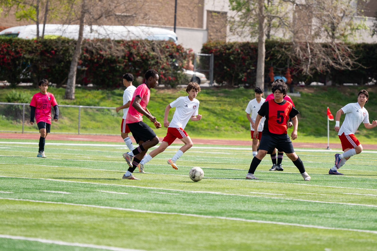 Soccer game in progress on a green field